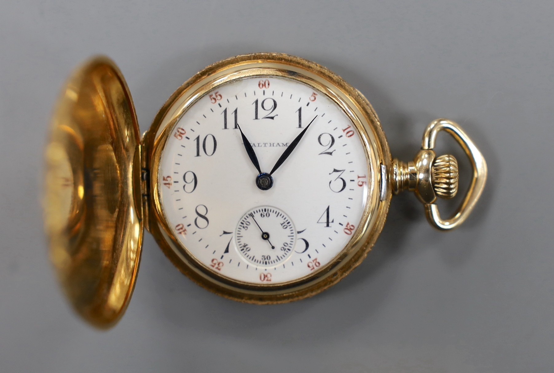 An early 20th century engraved 14k Waltham keyless hunter fob watch, with Arabic dial and engraved inscription